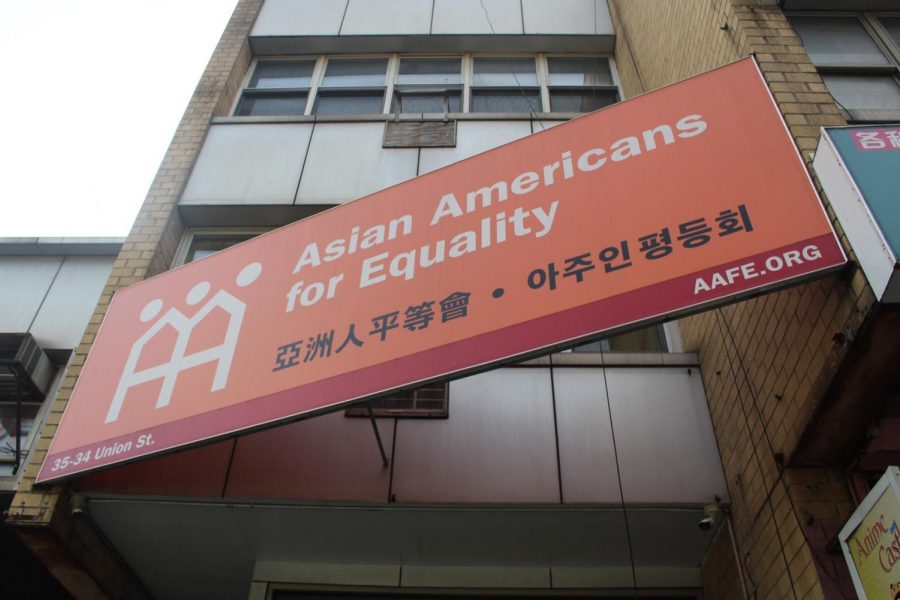 The facade of the Asian Americans for Equality office masks the busy and hard working nature of the office with a bright orange and white sign in a quiet block in Flushing. 
