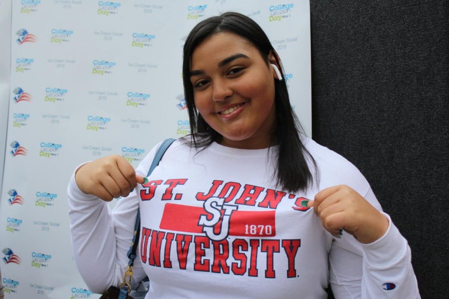 St. Johns Bound: Francis Lewis High School senior proudly displays her college decision. 