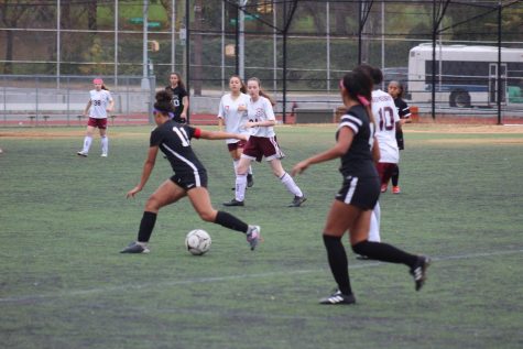 Cabral advances towards the goal, scoring her first goal of the playoff season. 