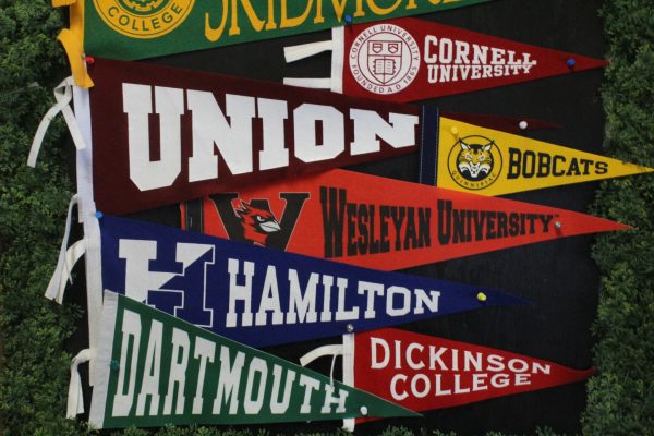 College pennants on College Counselor Cindi Isshiki's bulletin board.