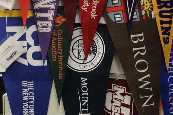College pennants in Mr. Mendez’s office.