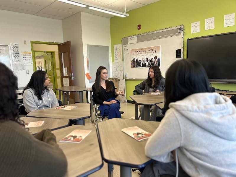 One of the speakers having a one on one talk with some students 